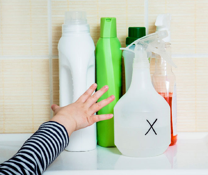 Child reaching for chemicals